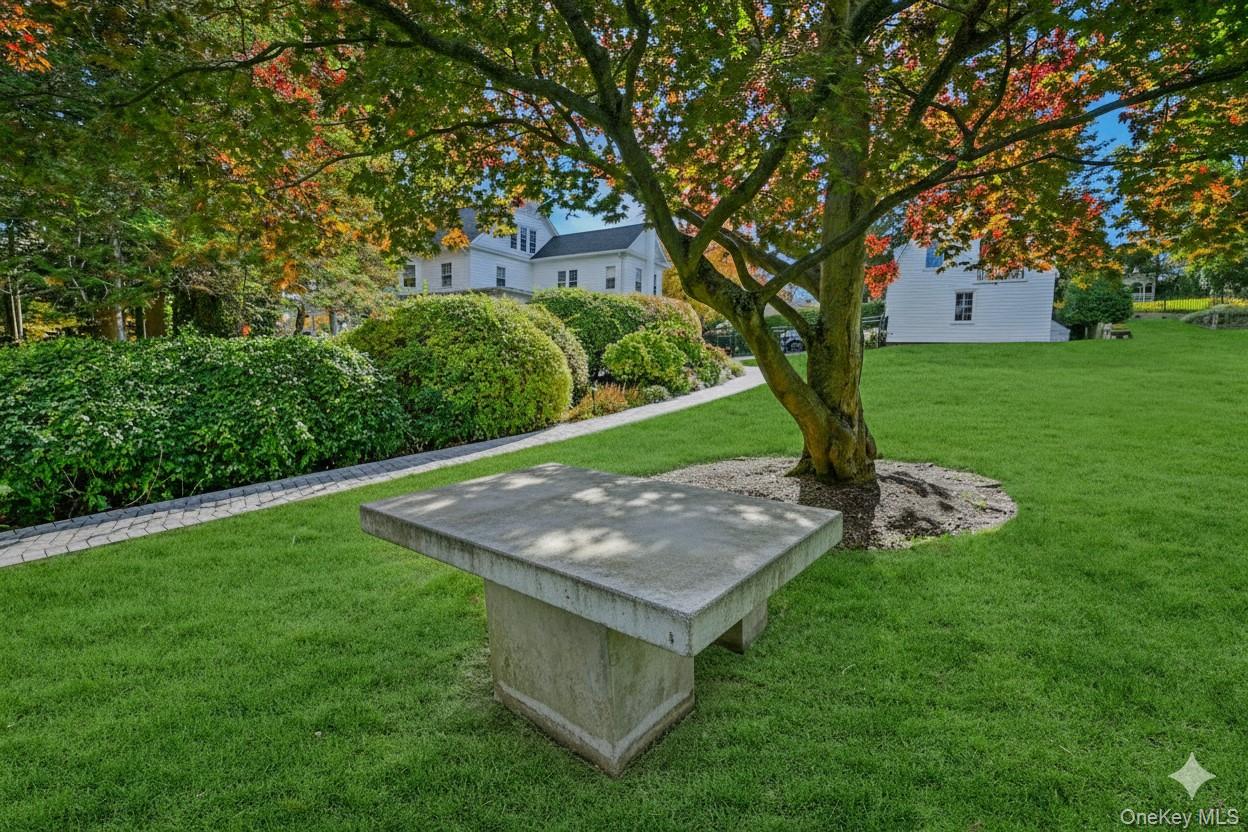 24 Harbor Hill Road Huntington Bay, NY 11743 - Photo 42 of 46 a view of a backyard with a garden and trees