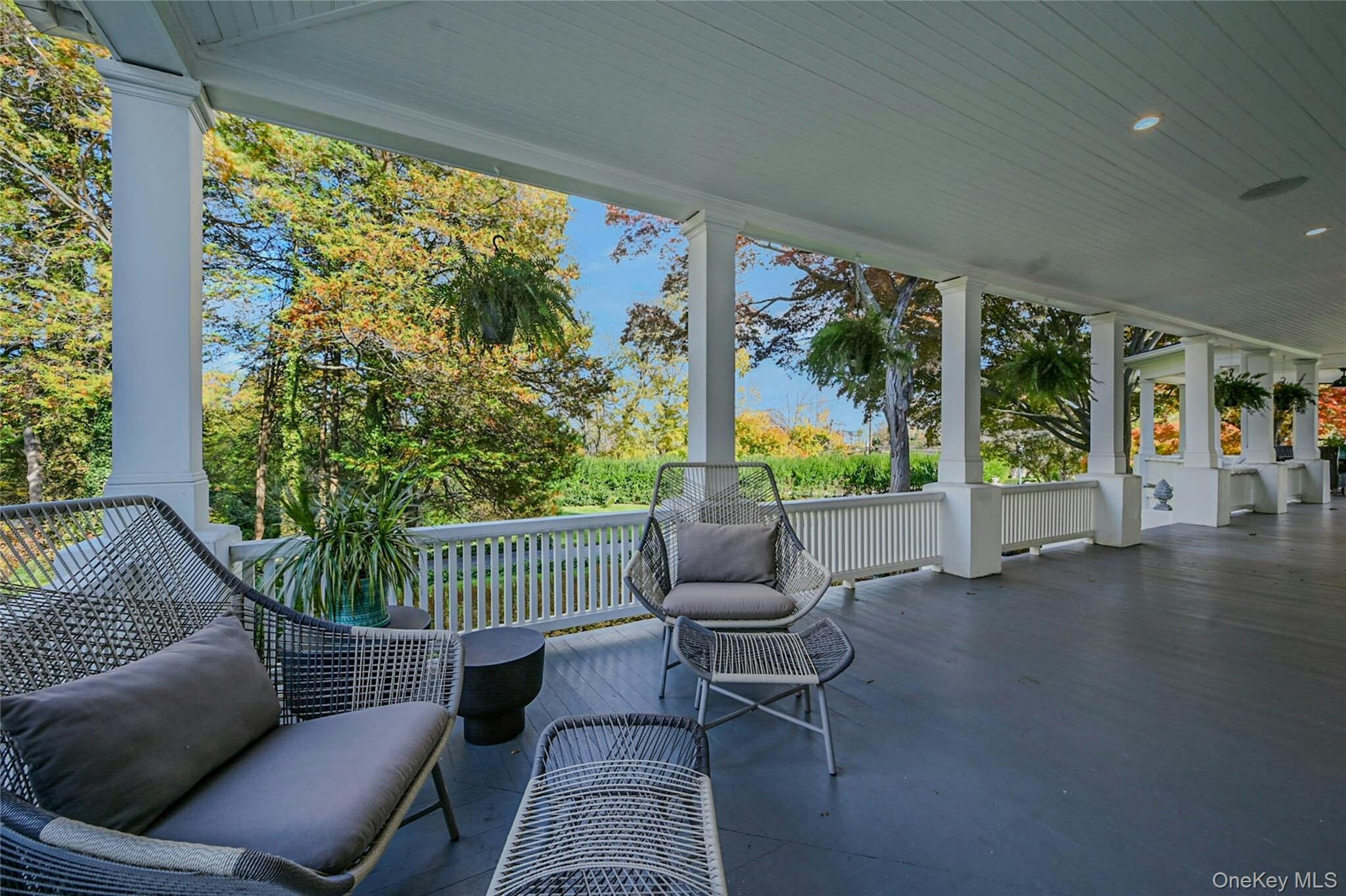 24 Harbor Hill Road Huntington Bay, NY 11743 - Photo 43 of 46 a balcony with furniture and a potted plant