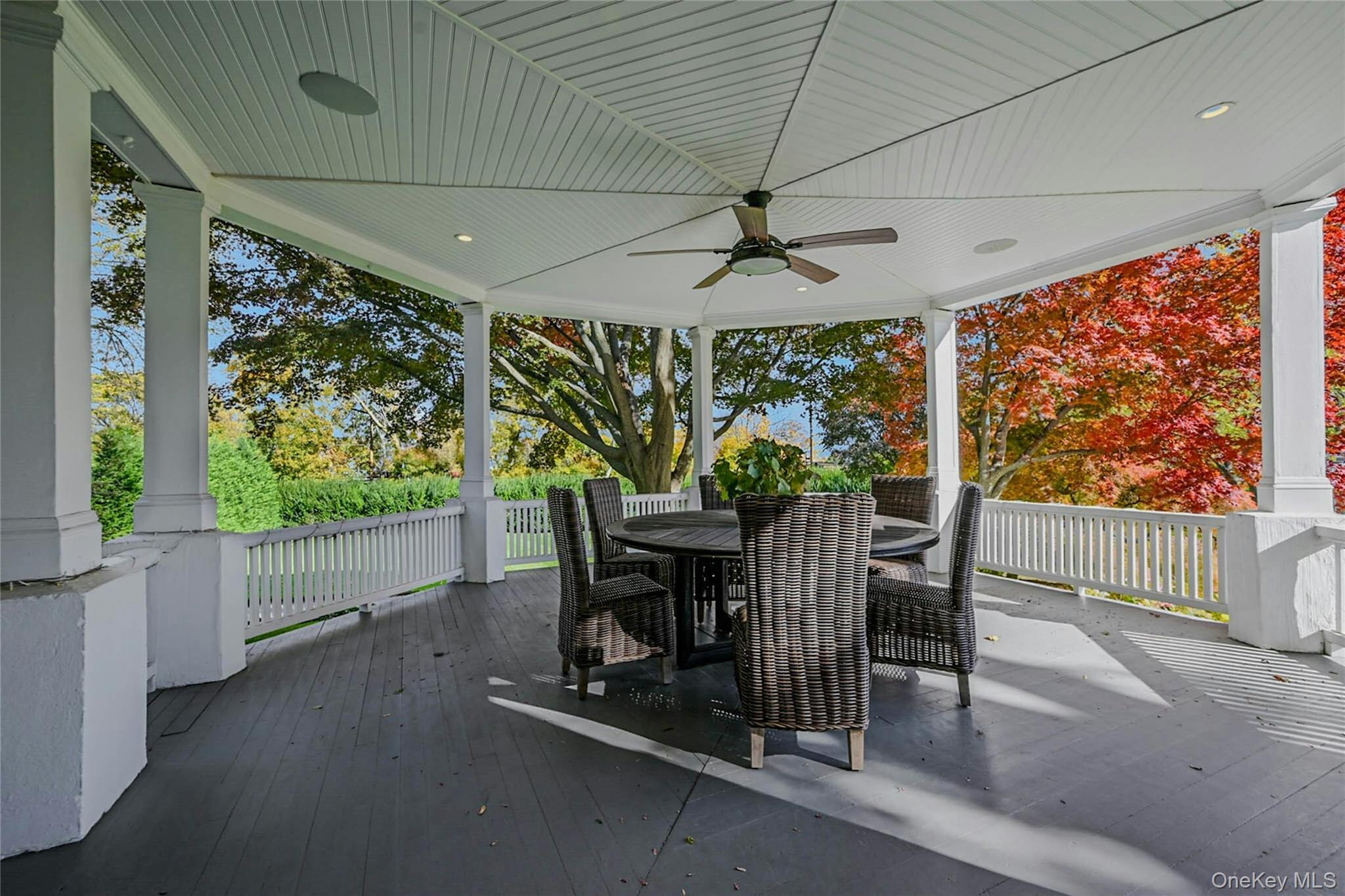 24 Harbor Hill Road Huntington Bay, NY 11743 - Photo 10 of 46 a view of a porch with furniture and a yard