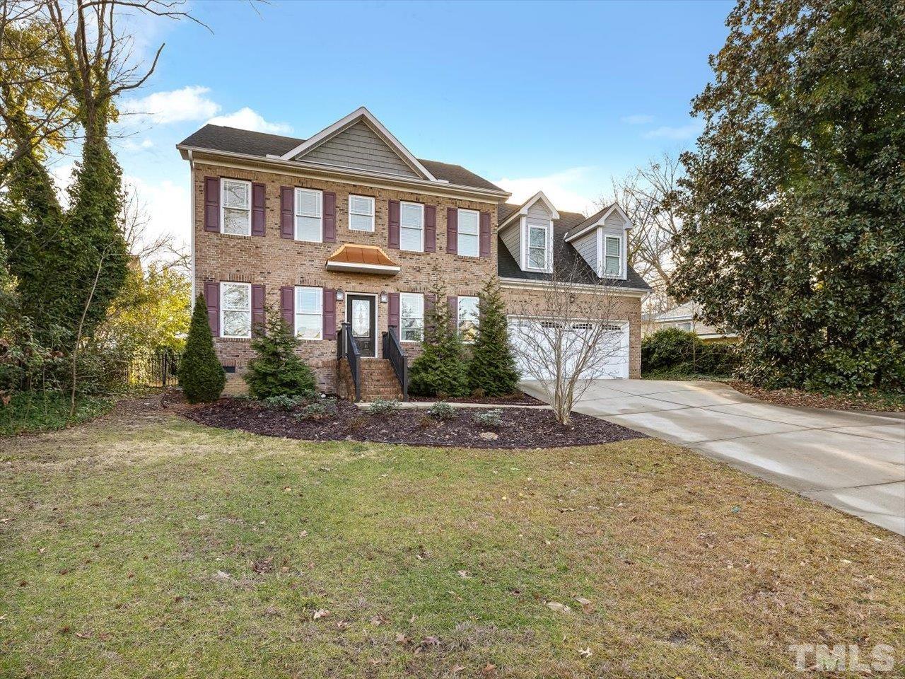 911 Wade Avenue Raleigh, NC 27605 - Photo 1 of 60 a front view of a house with a yard and garage