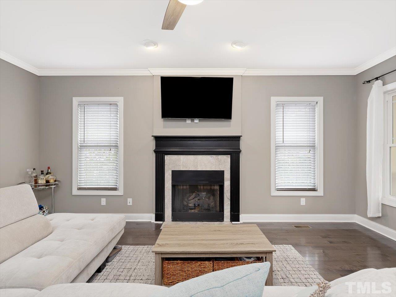 911 Wade Avenue Raleigh, NC 27605 - Photo 13 of 60 a living room with furniture fireplace and flat screen tv