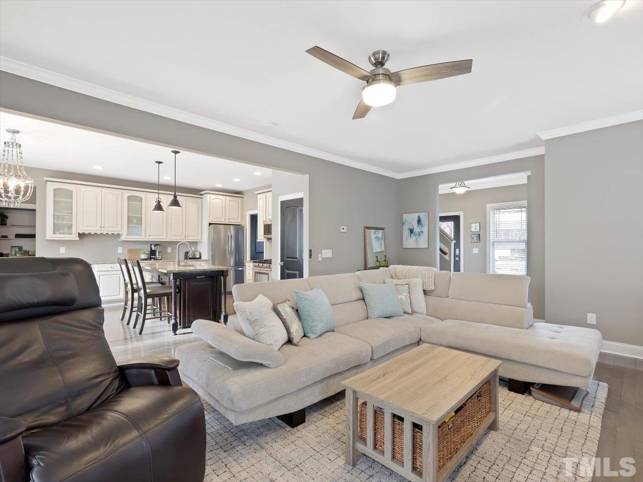 911 Wade Avenue Raleigh, NC 27605 - Photo 15 of 60 a living room with furniture and a view of kitchen