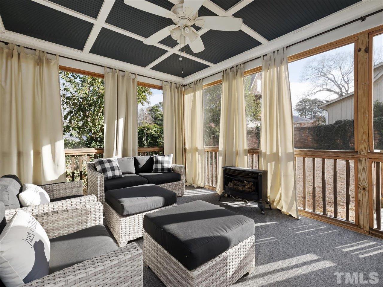 911 Wade Avenue Raleigh, NC 27605 - Photo 20 of 60 a living room with furniture and a fireplace