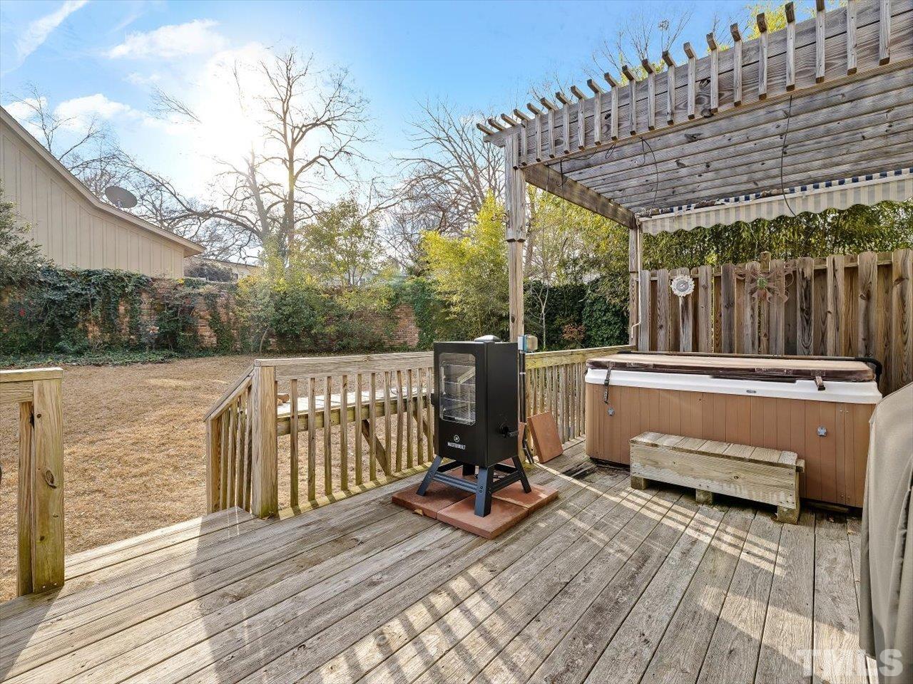 911 Wade Avenue Raleigh, NC 27605 - Photo 24 of 60 a view of balcony with wooden floor and outdoor seating