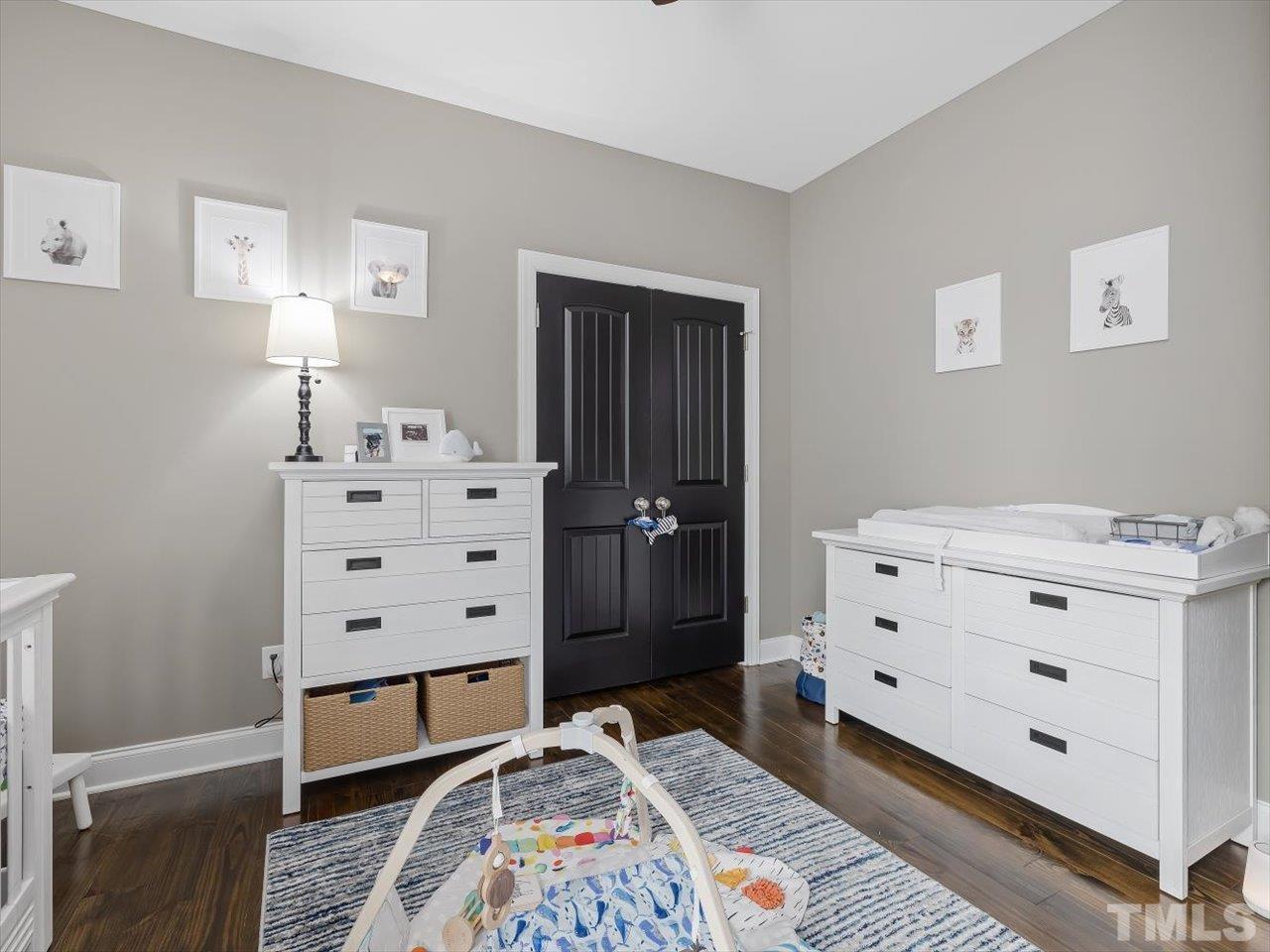 911 Wade Avenue Raleigh, NC 27605 - Photo 40 of 60 a bedroom with a bed and a dresser