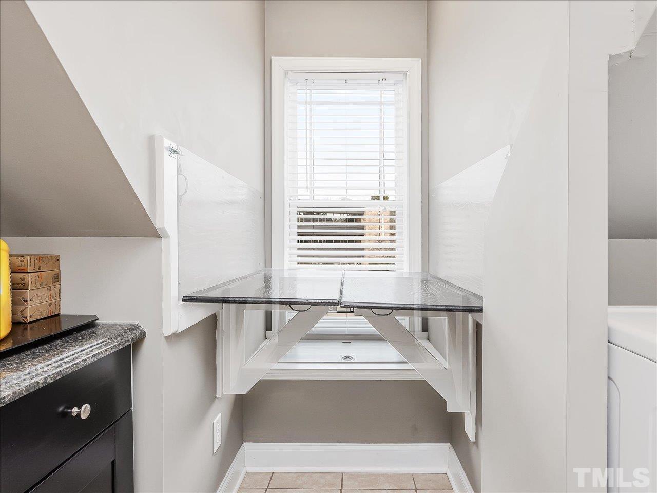 911 Wade Avenue Raleigh, NC 27605 - Photo 52 of 60 a view of a kitchen with a sink and dishwasher