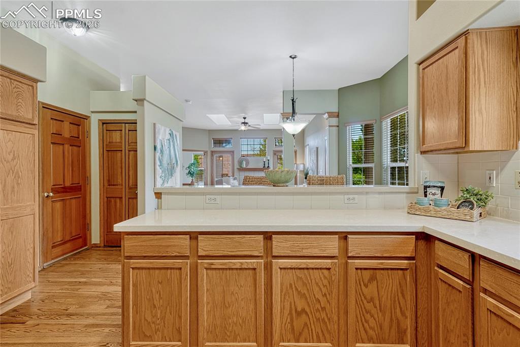 4601 Rowell Point Colorado Springs, CO 80923 - Photo 13 of 48 This angle of the kitchen shows its fantastic open concept overlooking the living spaces