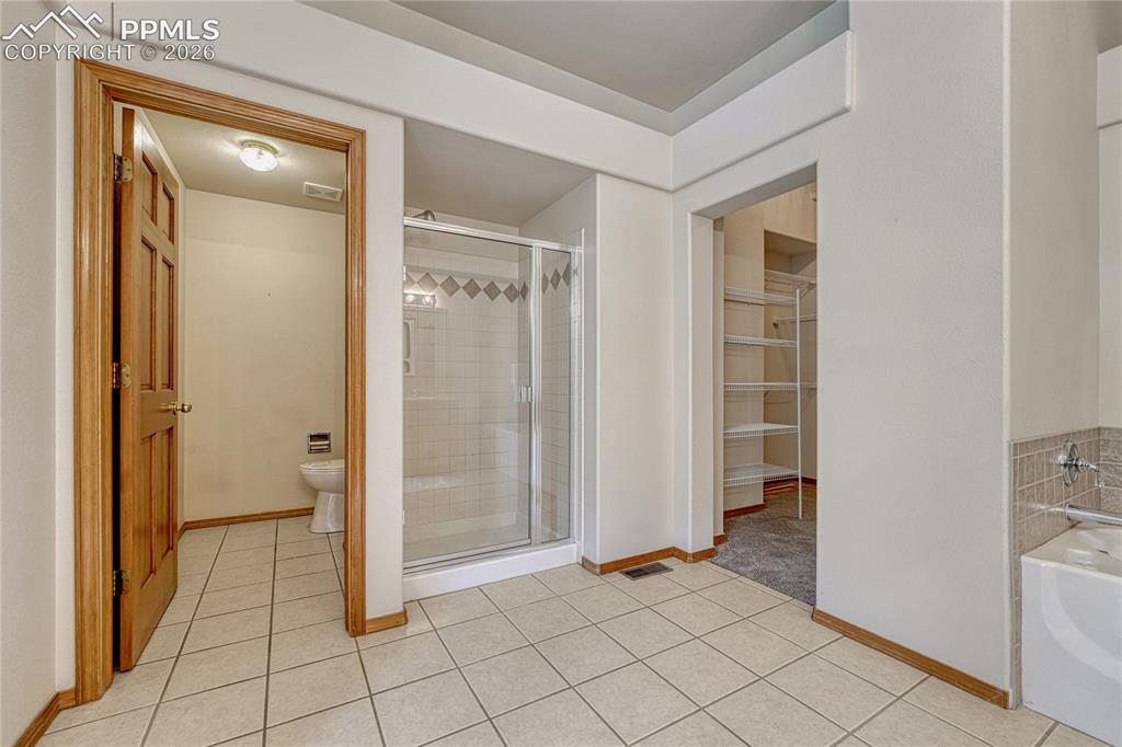 4601 Rowell Point Colorado Springs, CO 80923 - Photo 25 of 48 The en-suite's smart layout includes a deep water closet for added privacy