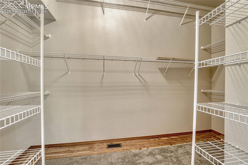 4601 Rowell Point Colorado Springs, CO 80923 - Photo 26 of 48 You'll love the extra-large walk-in closet attached to the primary suite, providing excellent storage for your wardrobe