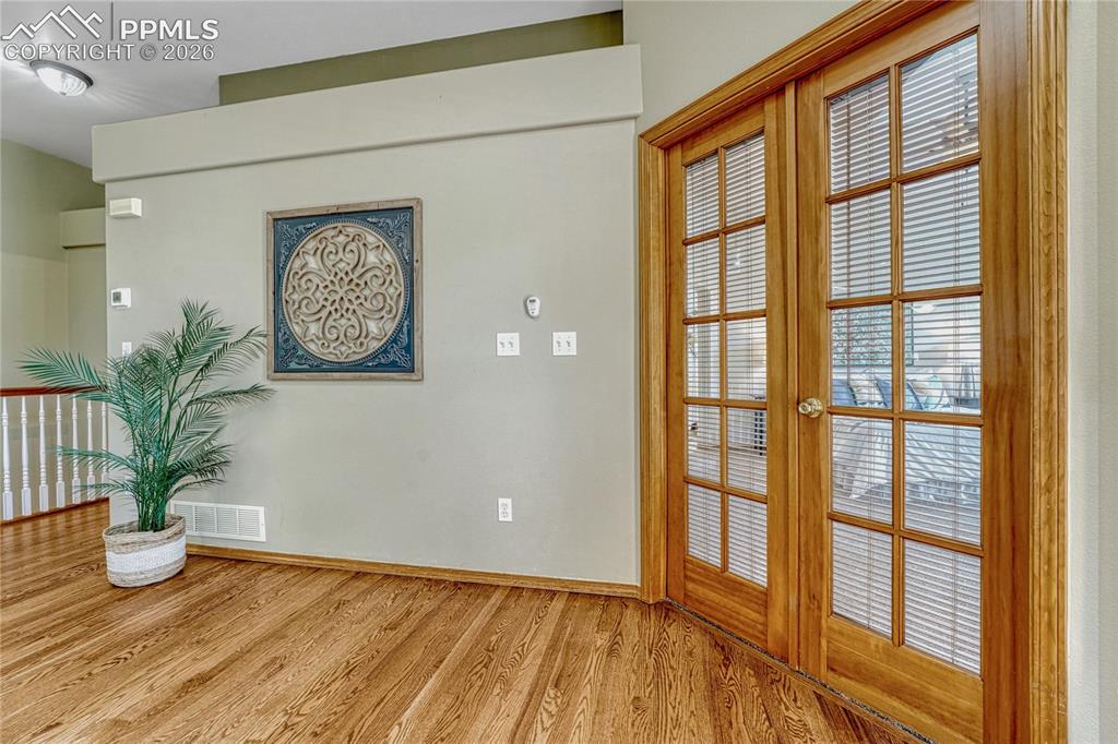 4601 Rowell Point Colorado Springs, CO 80923 - Photo 27 of 48 Elegant interior French doors add a sophisticated architectural detail to the main level