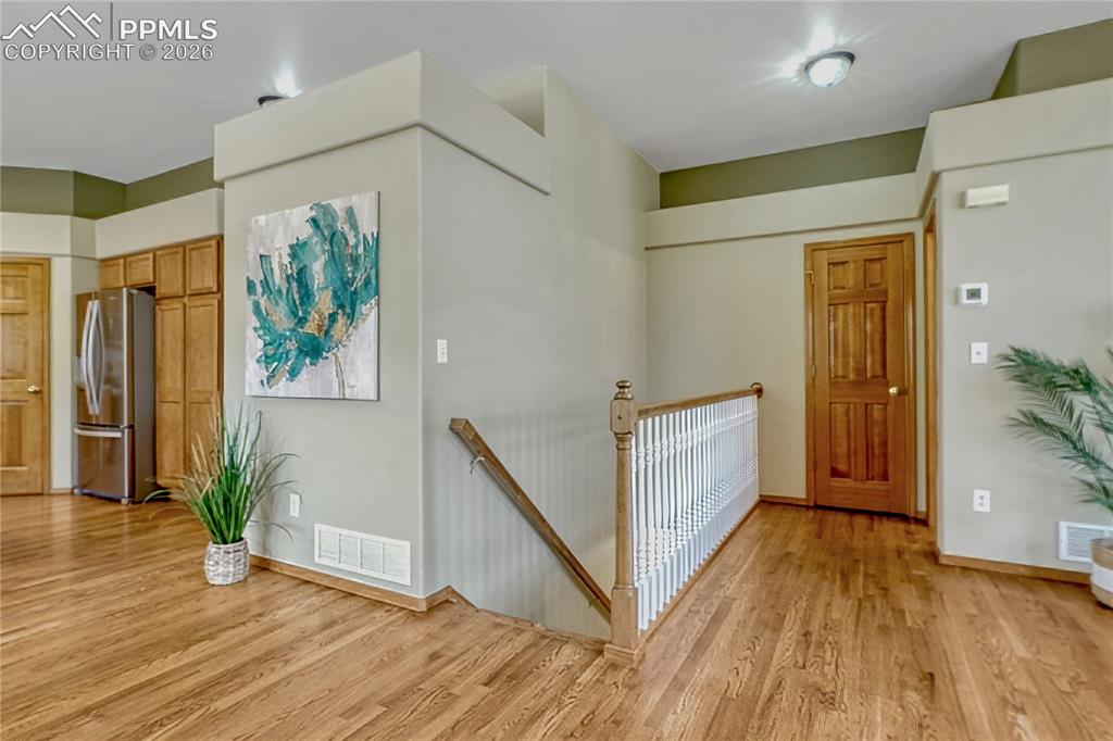 4601 Rowell Point Colorado Springs, CO 80923 - Photo 28 of 48 Head down the open staircase to discover the sprawling finished basement, which makes up 92% of the lower level
