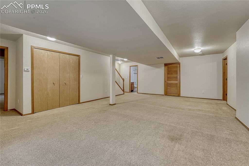 4601 Rowell Point Colorado Springs, CO 80923 - Photo 29 of 48 The fully finished basement features a massive family room perfect for easy entertaining