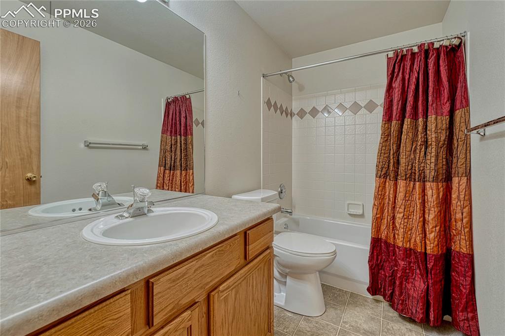 4601 Rowell Point Colorado Springs, CO 80923 - Photo 33 of 48 The full basement bathroom is conveniently located near the bedrooms and features a shower/tub combo and a storage vanity