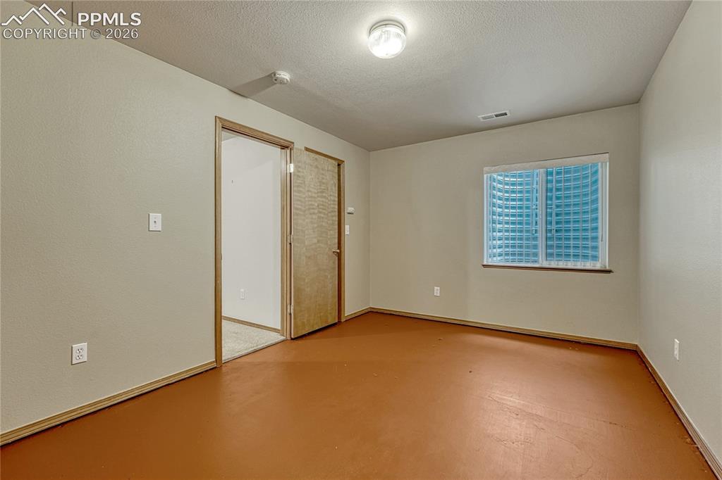 4601 Rowell Point Colorado Springs, CO 80923 - Photo 36 of 48 The basement includes a secondary bedroom space providing plenty of room for guests or a hobby area