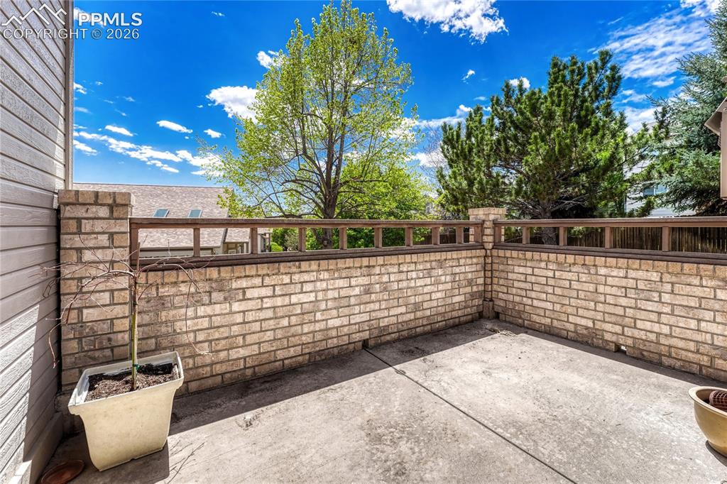 4601 Rowell Point Colorado Springs, CO 80923 - Photo 37 of 48 Step outside to your private concrete patio, perfect for enjoying Colorado's beautiful weather