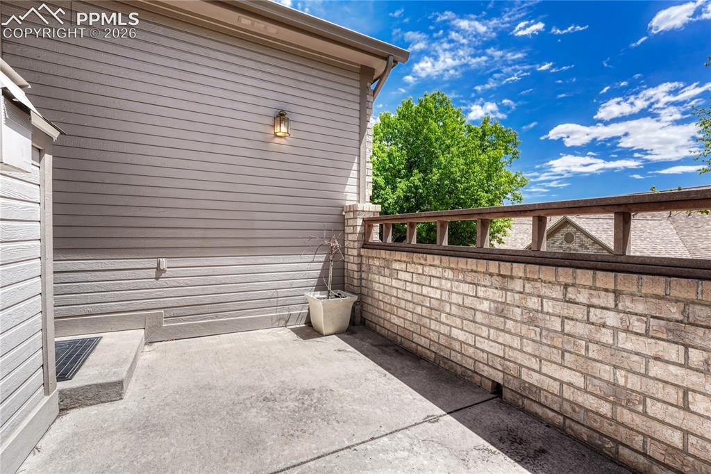 4601 Rowell Point Colorado Springs, CO 80923 - Photo 38 of 48 This low-maintenance patio space provides the perfect spot for a quiet evening outdoors, securely bordered by beautiful brick