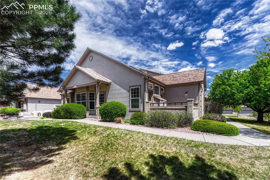 4601 Rowell Point Colorado Springs, CO 80923 - Photo 40 of 48 This exterior view showcases the home's newer composite shingle roof