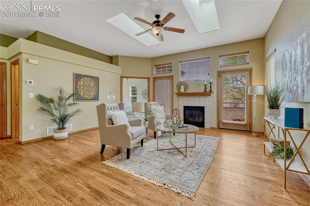 4601 Rowell Point Colorado Springs, CO 80923 - Photo 4 of 48 High ceilings elevate the main living area, offering a sprawling open-concept flow. French doors provide direct access from the living space to the primary suite
