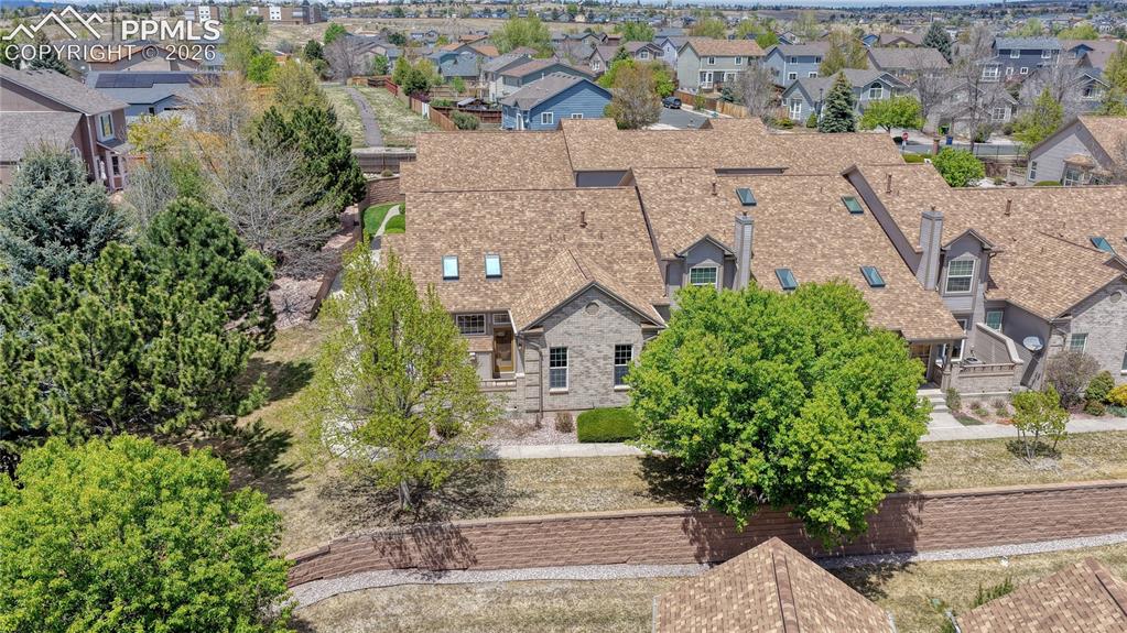 4601 Rowell Point Colorado Springs, CO 80923 - Photo 45 of 48 Nestled among mature trees, this home offers a sense of established charm within the pet-friendly Saddleback at Newport Heights neighborhood.