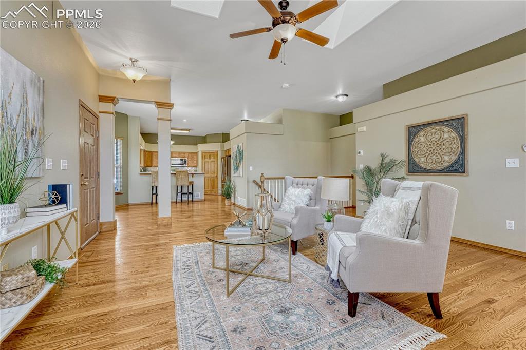 4601 Rowell Point Colorado Springs, CO 80923 - Photo 6 of 48 The elegant hardwood floors run seamlessly through the main level. Notice the convenient layout connecting directly to the gourmet, natural wood kitchen
