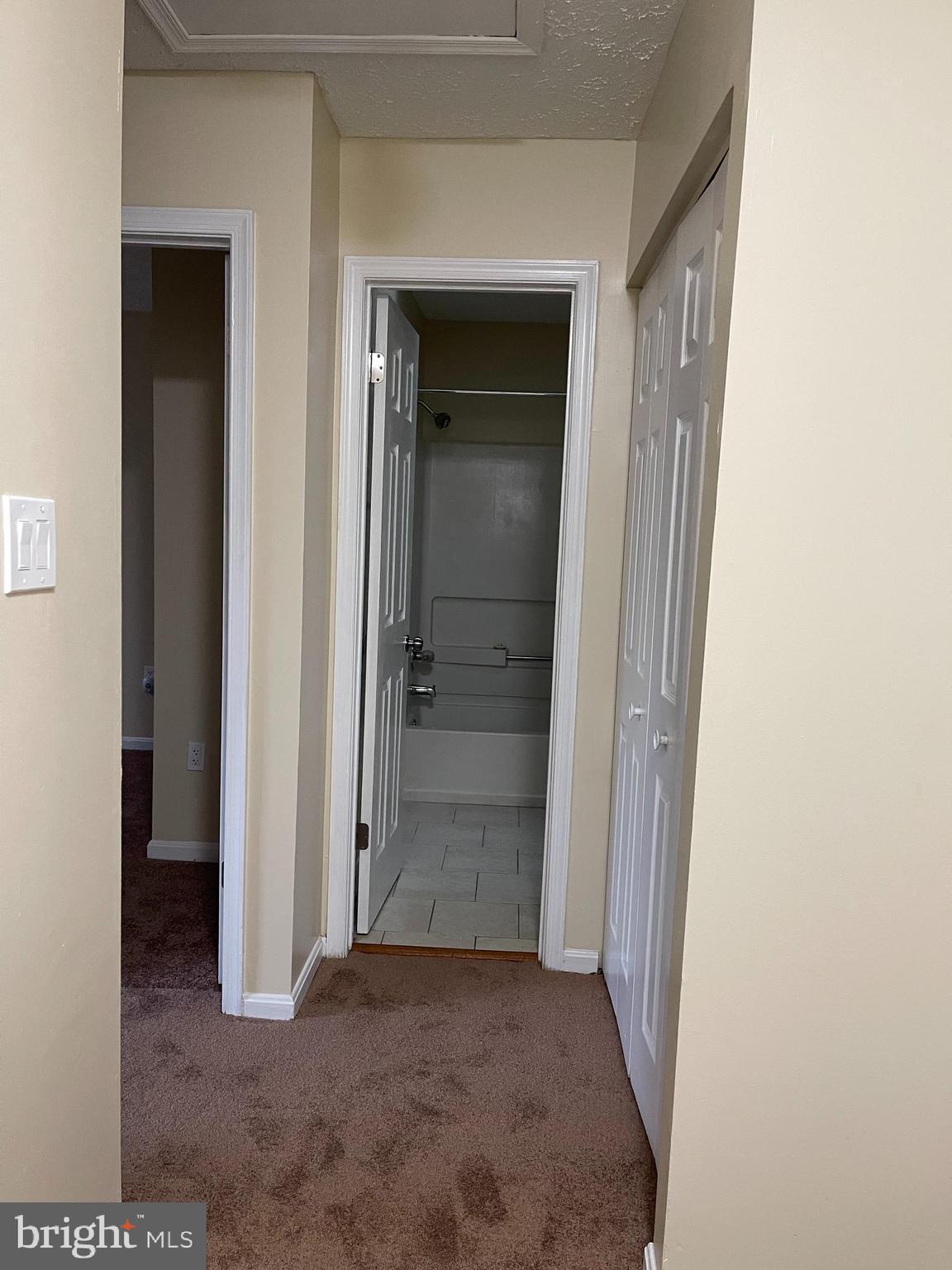 2420 Rosecroft Court Oxon Hill, MD 20745 - Photo 11 of 29 a view of a hallway with wooden shelves