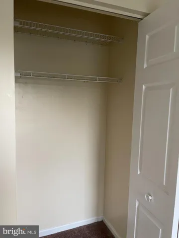 a view of a hallway with a room