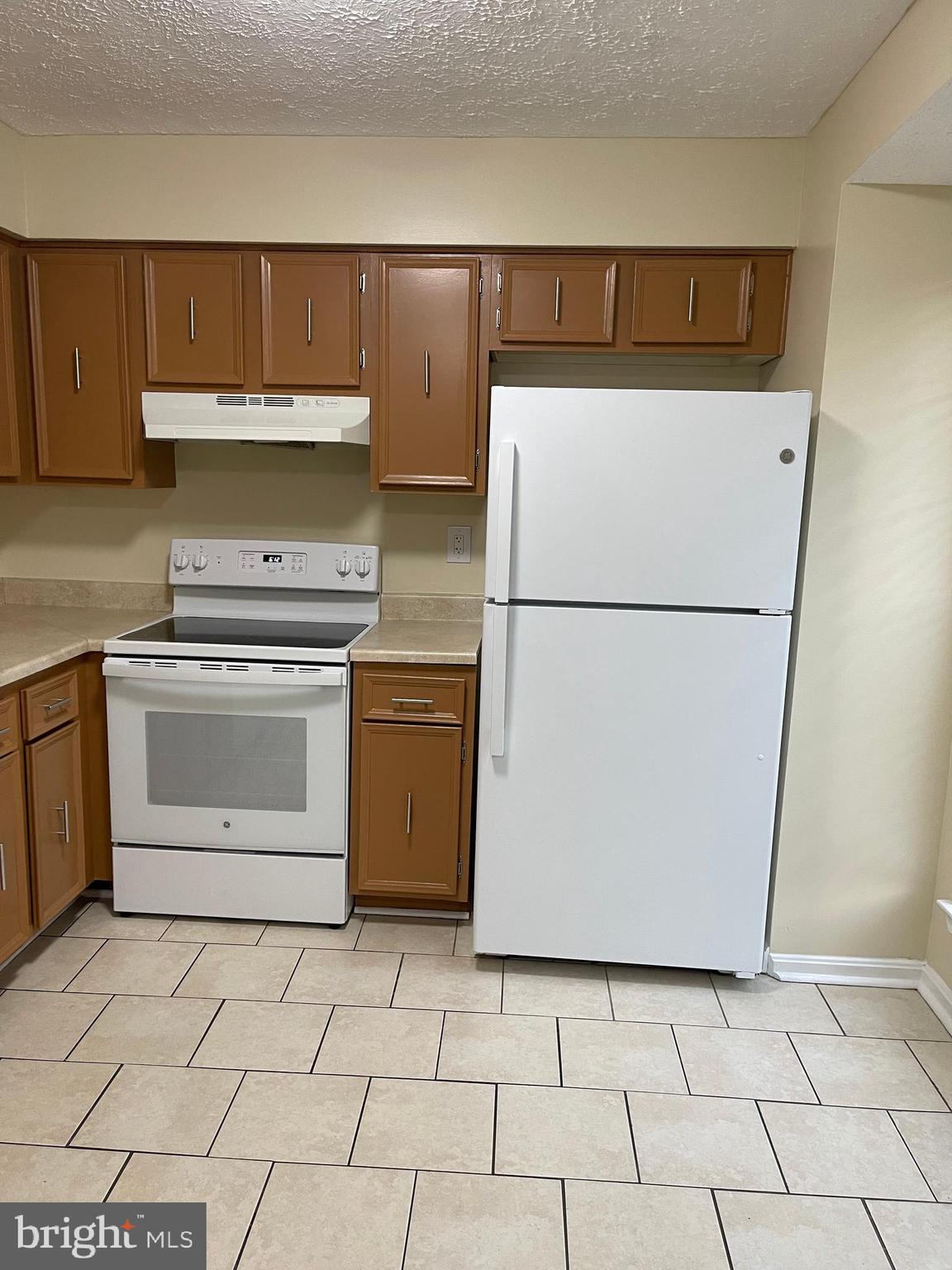 2420 Rosecroft Court Oxon Hill, MD 20745 - Photo 27 of 29 a utility room with cabinets washer and dryer