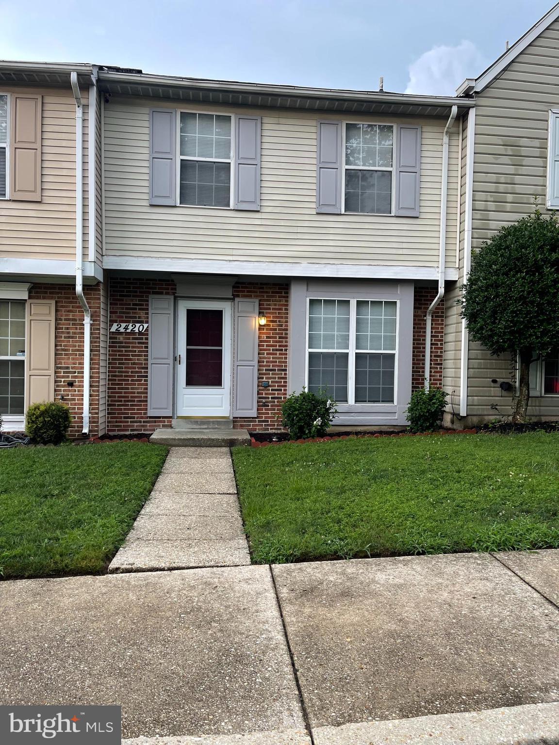 2420 Rosecroft Court Oxon Hill, MD 20745 - Photo 3 of 29 a front view of a house with a yard