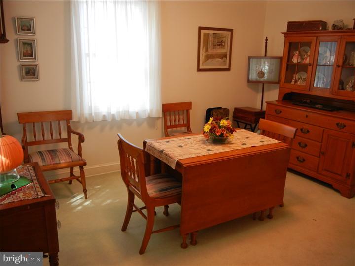 306 Smithfield Road Wallingford, PA 19086 - Photo 3 of 16 a room with furniture a rug and a window