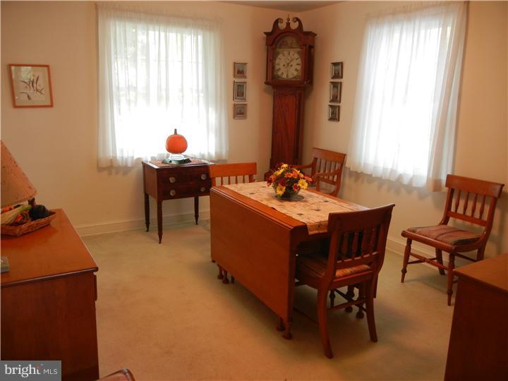 306 Smithfield Road Wallingford, PA 19086 - Photo 4 of 16 a room with a table chairs and a window