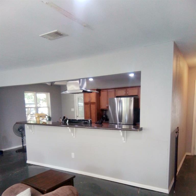 5786 Rockhill Road Fort Worth, TX 76112 - Photo 19 of 26 a view of a kitchen with a sink and window
