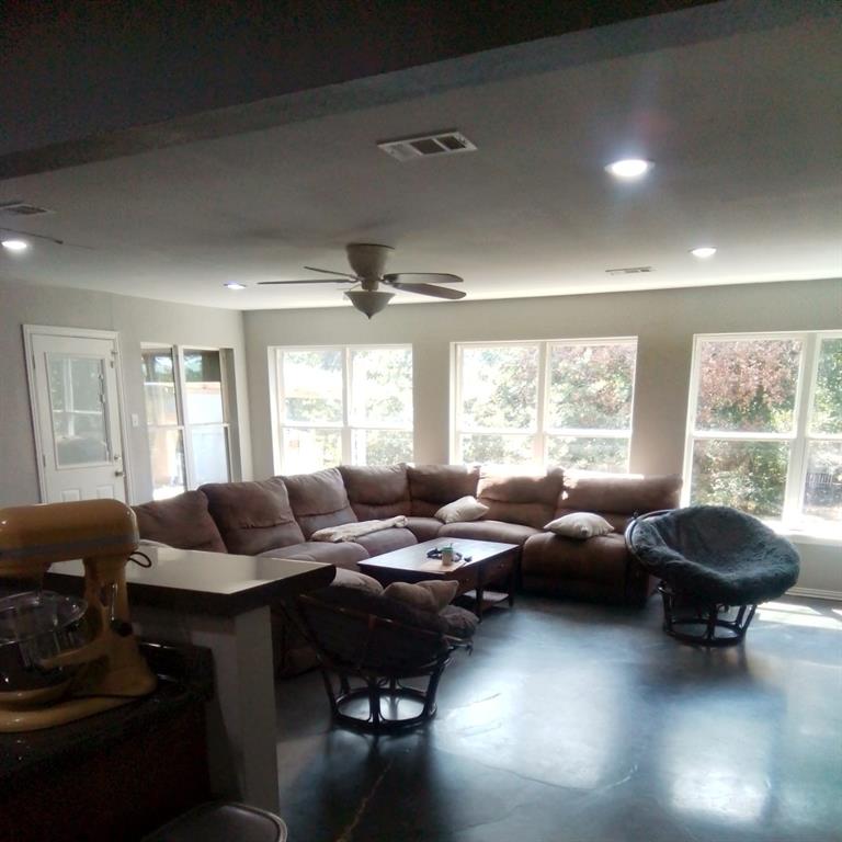5786 Rockhill Road Fort Worth, TX 76112 - Photo 21 of 26 a living room with furniture and a window