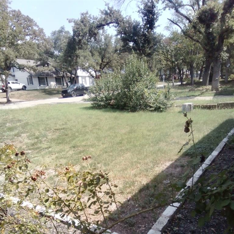 5786 Rockhill Road Fort Worth, TX 76112 - Photo 23 of 26 a view of a lake with houses and yard