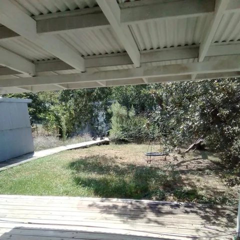a living room with furniture and a lamp