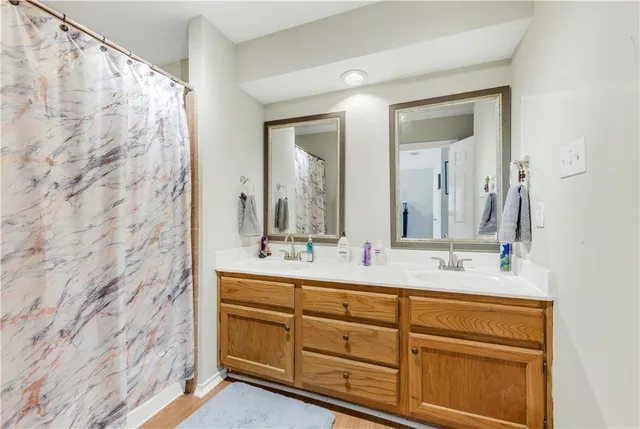 a bathroom with a double vanity sink mirror and double