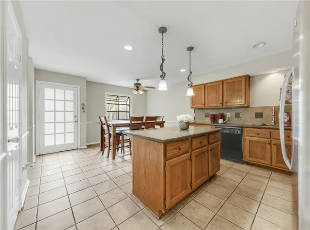 a kitchen with a sink counter top space appliances and cabinets