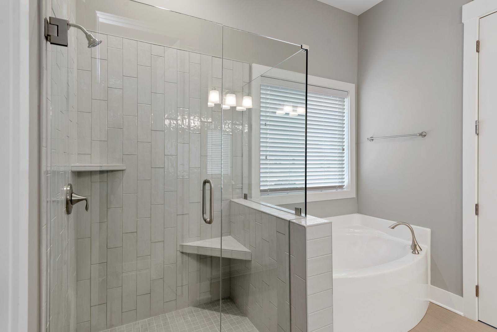 115 Nighthawk Road Hendersonville, TN 37075 - Photo 13 of 28 Frameless shower with elegant tub and tile floor