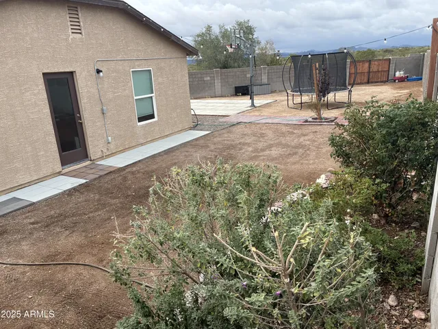 a view of a back yard of the house