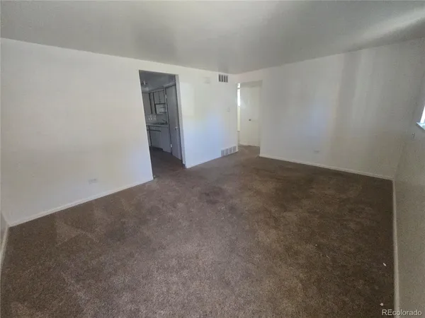 a kitchen with cabinets and a stove