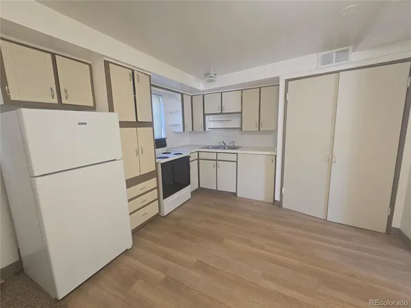 an empty room with a empty space and windows