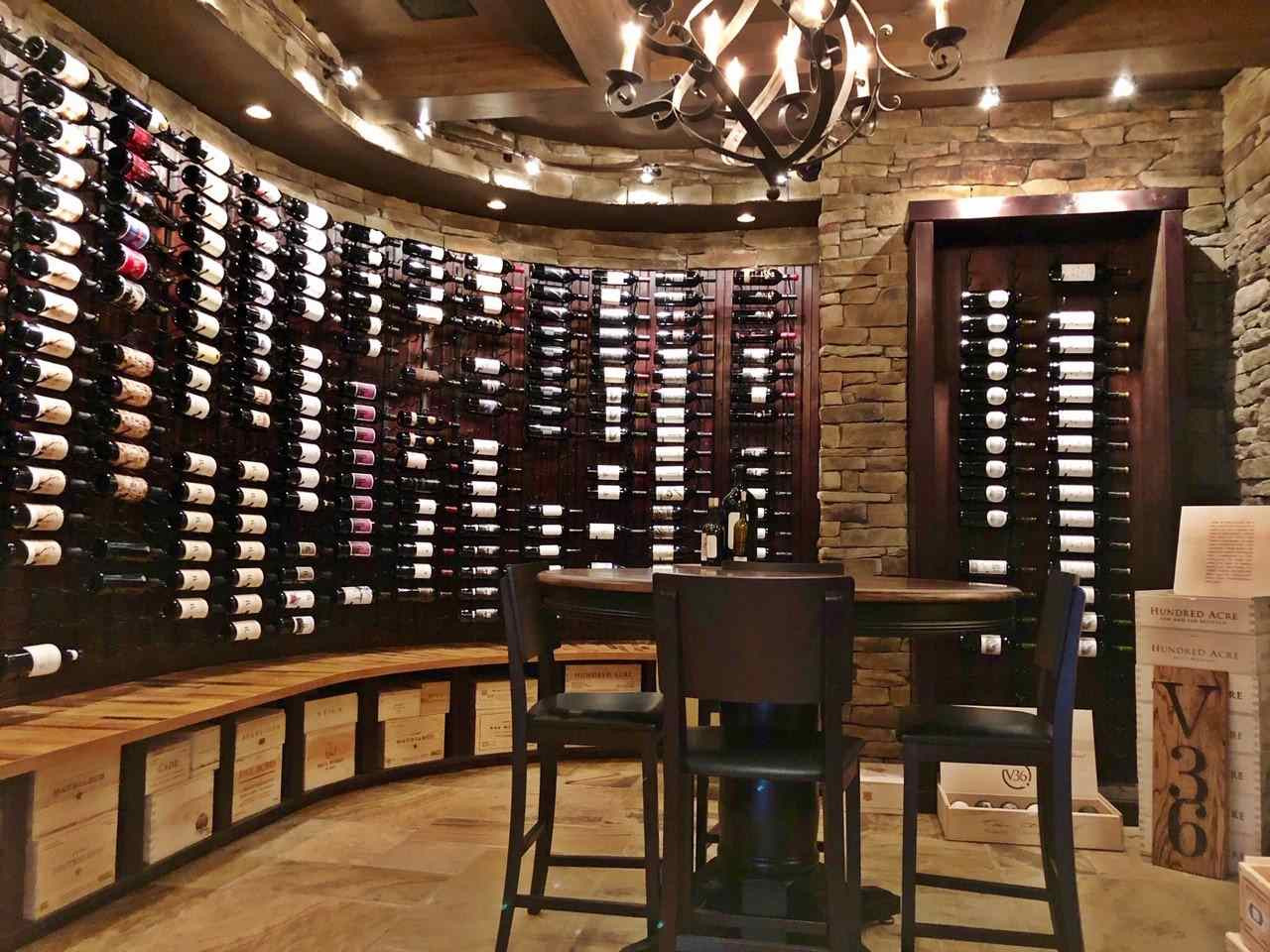1608 Sharnbrook Court Raleigh, NC 27614 - Photo 9 of 30 1000 bottle temperature controlled custom wine cellar. Built in niches for special bottle display with recessed lighting. Tasting table, tile floor with old world look, built in cabinets and storage with win racks Wine Cellar