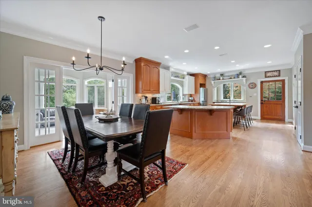 a large kitchen with kitchen island granite countertop a large window
