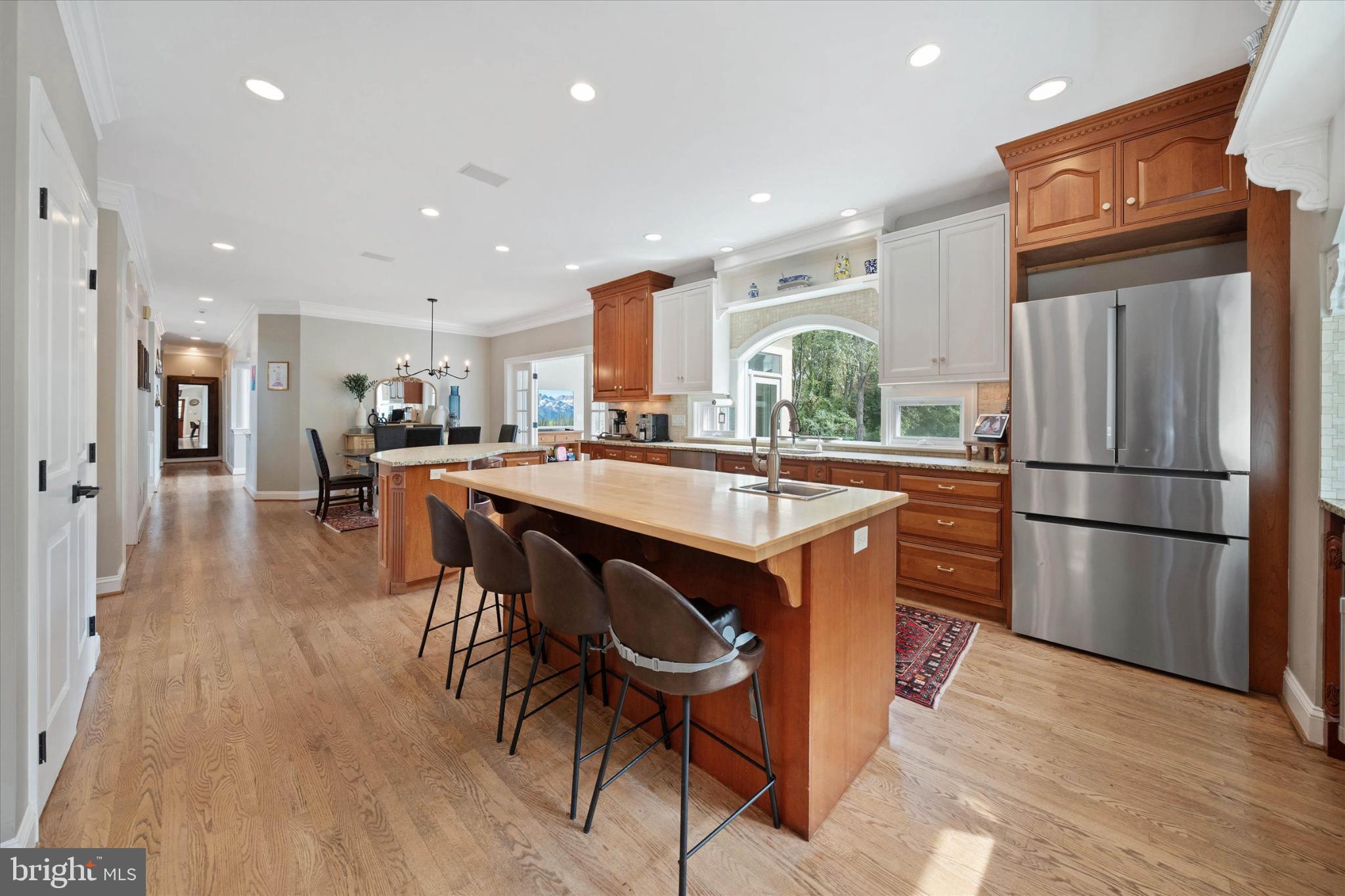 1540 Fairville Road Chadds Ford, PA 19317 - Photo 24 of 86 a kitchen with stainless steel appliances granite countertop a refrigerator a sink a stove a dining table and chairs