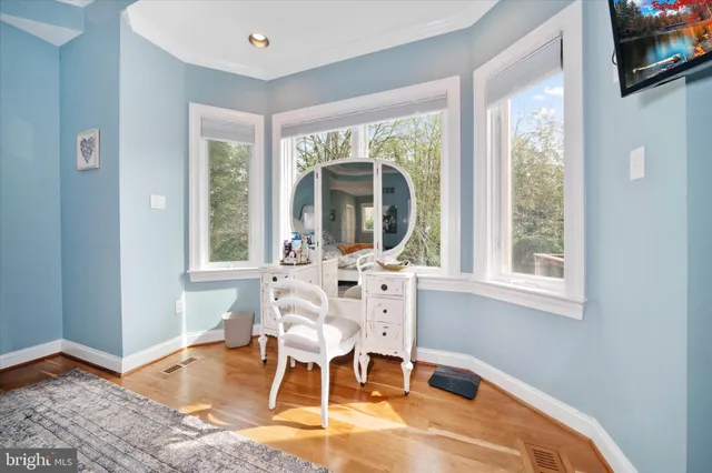 a bedroom with a bed and a table in it