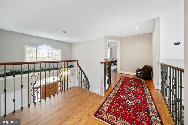 a bedroom with furniture and a wooden floor