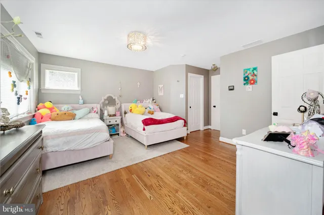 a view of a patio with couches table and chairs and potted plants