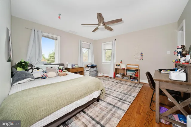 an aerial view of a house with swimming pool and garden view