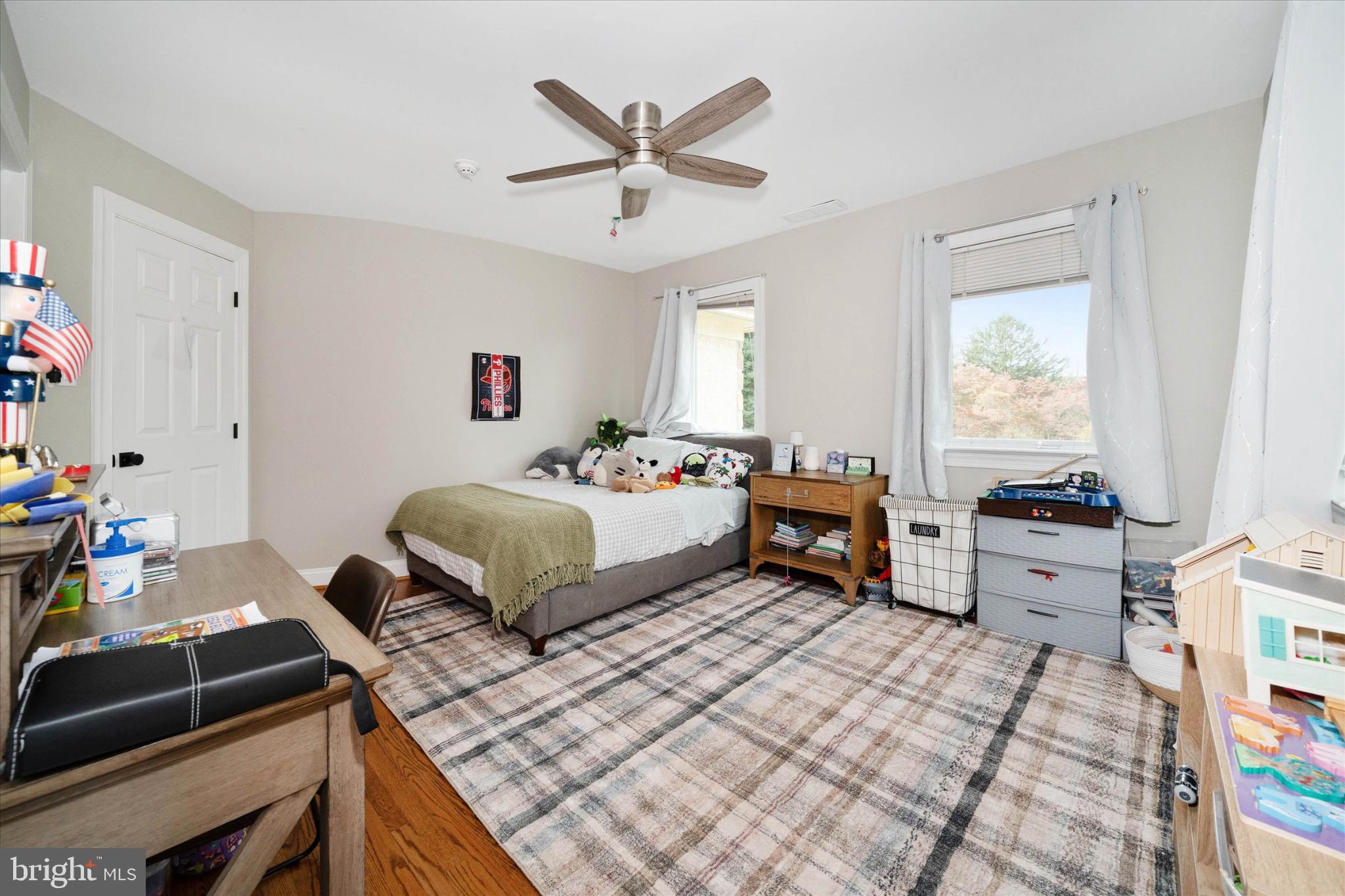 1540 Fairville Road Chadds Ford, PA 19317 - Photo 49 of 86 a bedroom with a bed and a chandelier