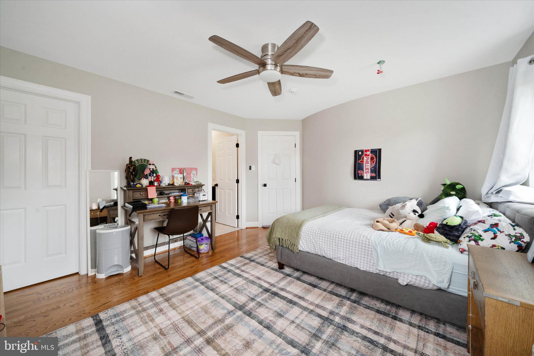 1540 Fairville Road Chadds Ford, PA 19317 - Photo 50 of 86 a bedroom that has a bed and a chandelier