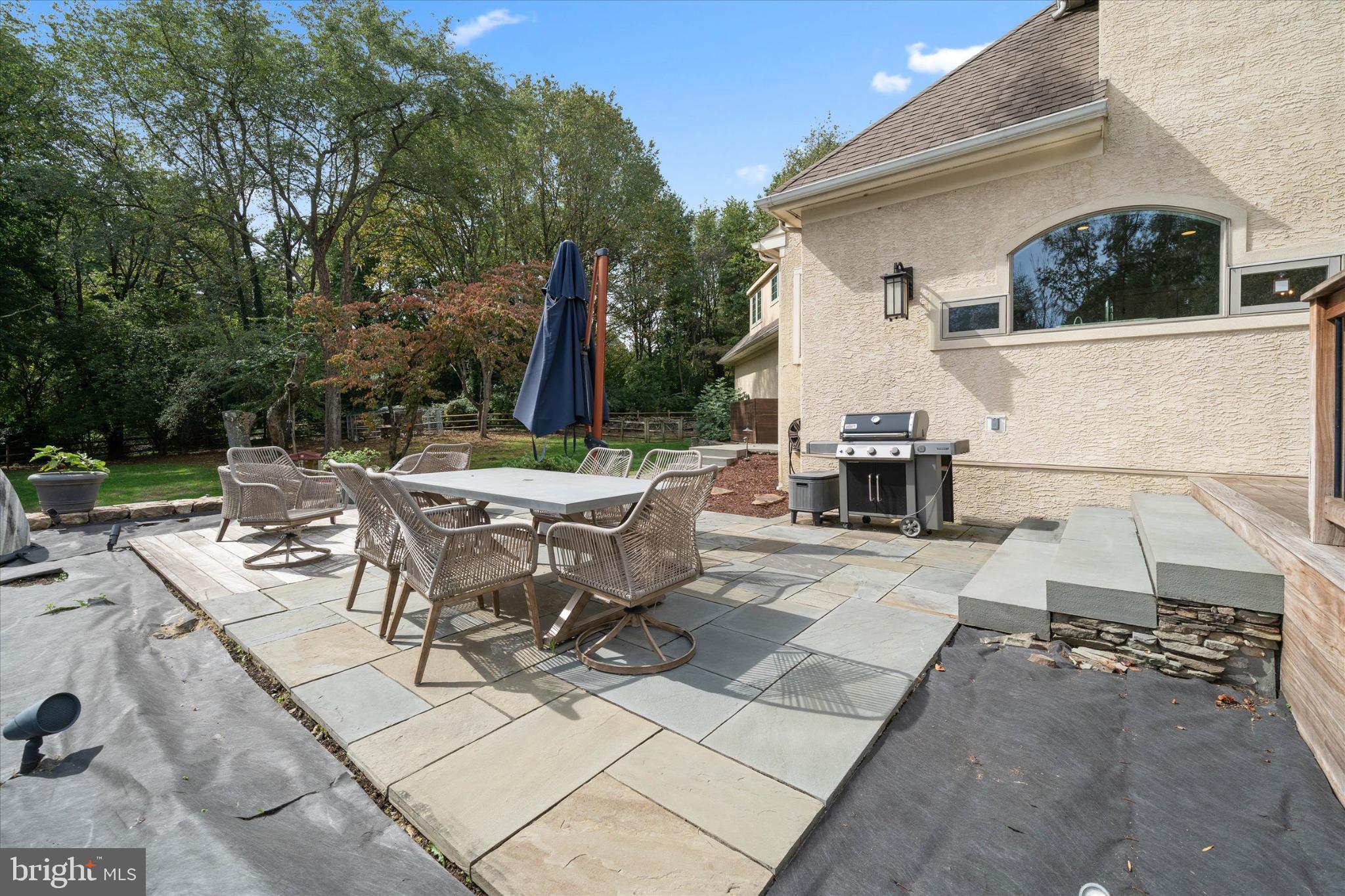 1540 Fairville Road Chadds Ford, PA 19317 - Photo 72 of 86 a view of a patio with table and chairs and potted plants